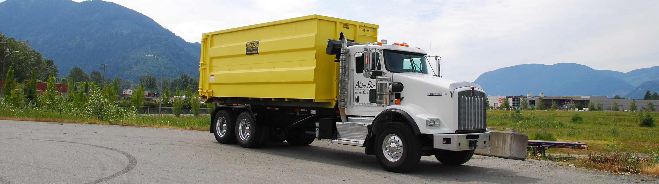 Abby Bin Truck with roll-off container